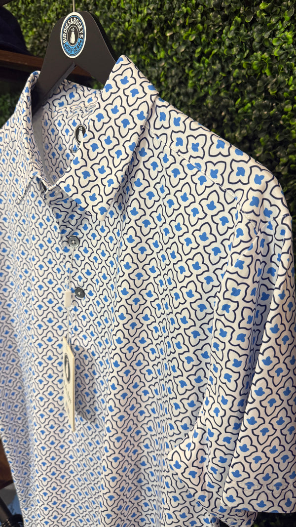 A short-sleeve button-up shirt with a white base and an intricate blue and black geometric pattern.