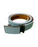 A light teal textured leather belt with a brown interior lining and a dark metallic automatic buckle, coiled on a white background. Golf bag logo on buckle