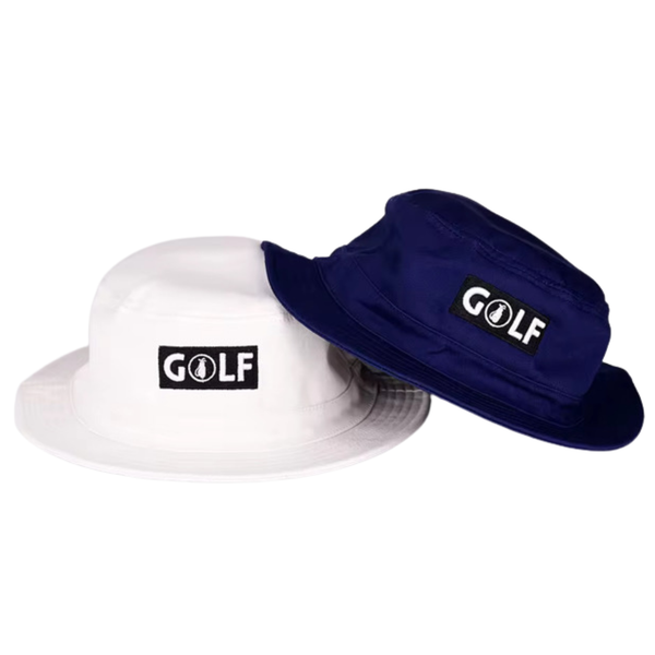 Two bucket hats on a plain white background, one white and one navy blue, each with a black rectangular patch on the front that reads 'GOLF' in white letters.