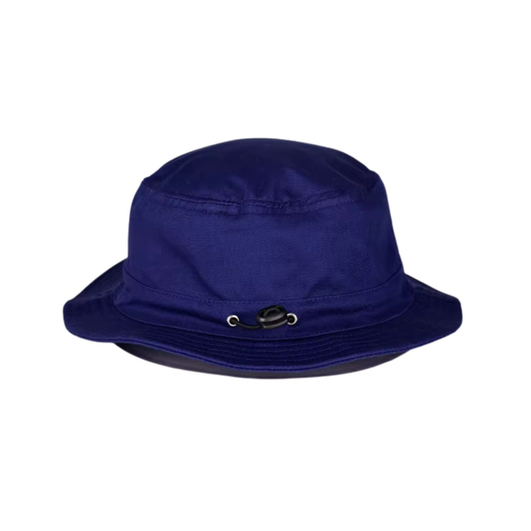 A royal blue bucket hat with a small black decorative emblem and silver grommets on the front center of the crown, shown against a plain white background.